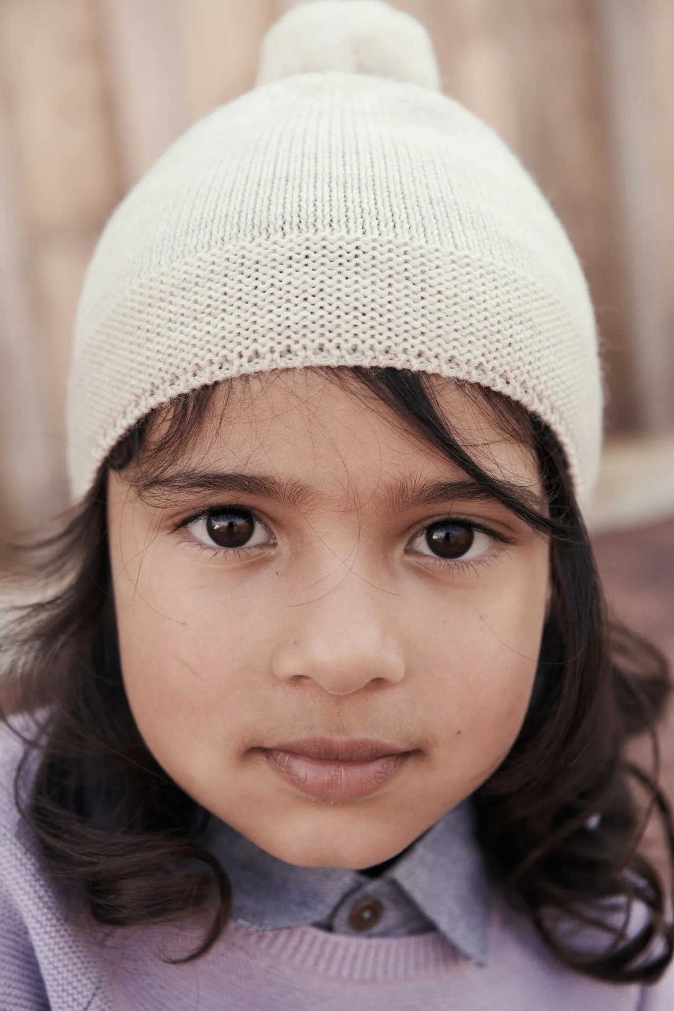 KNITTED BEANIE WITH POMPOM - PALE CREAM MELANGE